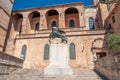 Bronze statue of a lion and the church of Sineu, Mallorca island