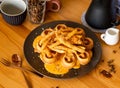 Sinful Cheese Potato Fries Waffle with coffee beans, fork, spoon served in dish isolated on wooden table top view of taiwan food