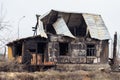 A sinful house, arson incident. Broken roof and glass windows, charred walls. Arson of a one-story private house, property