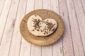 Sinful white chocolate palm tree with oreo cookie shavings on simile wooden plate