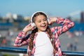 Sing happiness. Happy child wear headphones. Little music fan. Happy little girl. Little girl listen to music outdoor