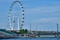 Singapore Flyer Ferris Wheel with view of The Float @ Marina Bay Royalty Free Stock Photo