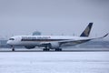 Singapore Airlines Airbus taking off from Munich Airport, MUC snow