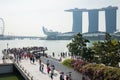 Singapore - Apr 30, 2016: Crowded tourists visiting Marina Bay, Singapore. Marina Bay Sands on background