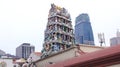 SINGAPORE - APR 3rd 2015: The Sri Mariamman Hindu Temple in Chinatown with skyscraper in the background
