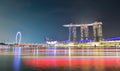 Panorama background of Marina Bay, Singapore City at night with long exposure light of boat