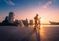 SINGAPORE - APRIL 30, 2018: Unidentified people runnig in Merlion Park and Singapore city skyline at sunrise on April 30, 2018.