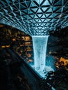 Vertical shot of the iconic waterfall of Jewel Changi Airport in Singapore