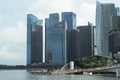 Singapore, August 19, 2023-Group of people walking on the walkway to Merlion with crowded of high modern buildings in background
