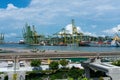 Singapore / August 17, 2020 : Port of Singapore , view of ships and cranes of the Brani terminal.