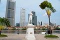 Sir Thomas Stamford Bingley Raffles statue with modern buildings at the background in Singapore, Singapore. Royalty Free Stock Photo