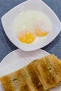 Singapore Breakfast Kaya Toast, Coffee bread and Half boiled egg Royalty Free Stock Photo