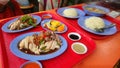 Singapore chicken rice set meals with garlic, ginger and black soy sauce served with soup
