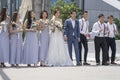 Asian style wedding ceremony on a street in Singapore. Bride and groom and guests In the wedding ceremony
