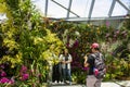 Tourists Are Taking Photos Inside The Flower Dome In Gardens By The Bay, Singapore.