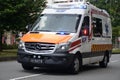 A Singapore Civil Defense Force 6th Generation ambulance vehicle driving past the heartlands at Jurong West Avenue 5 during the na