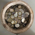 Singapore coins in a bucket