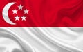 Singapore country flag on wavy silk fabric background panorama