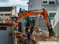 SINGAPORE Ã¢â¬â 24 DEC 2019 Ã¢â¬â Excavator / digger destroys / demolishes a house in a residential neighbourhood in suburban