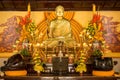 SINGAPORE/SINGAPORE - 23 DEC, 2015: Statue of Buddha sitting in meditation and waiting for Nirvana with hands in ritual gesture. I Royalty Free Stock Photo