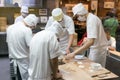 Staff making traditional chinese pork dumpling