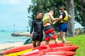 Singapore East Coast Park Beach. Canoe instructor giving guidance advises to two students