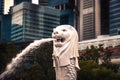 Singapore famous travel destination Merlion park with Merlion statue against financial district with skyscrapers at sunset