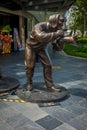 SINGAPORE, SINGAPORE - FEBRUARY 01, 2018: Bronze sculpture named Paparazzi Dog by Gillie and Marc Schattner, outdoor