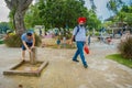 SINGAPORE, SINGAPORE - FEBRUARY 01, 2018: Unidentified people walking in front of many children playing in the water