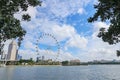 Singapore flyer with cityscape against blue sky Royalty Free Stock Photo