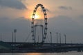 The Singapore Flyer with the morning rising sun in the backdrop Royalty Free Stock Photo