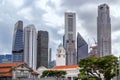 City cricket club and an old clock tower against the backdrop of modern Downtown skyscrapers Royalty Free Stock Photo