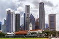 City cricket club and an old clock tower against the backdrop of modern Downtown skyscrapers Royalty Free Stock Photo