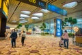 SINGAPORE, SINGAPORE - JANUARY 30, 2018: Indoor view of unidentified body guards walking close to a waiting lounge area