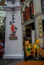 SINGAPORE, SINGAPORE - JANUARY 30. 2018: Outdoor view of stoned structure with two fake dogs on the floor during a