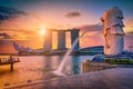 SINGAPORE-JULY 9, 2016: Merlion statue fountain in Merlion Park and Singapore city skyline at sunrise on July 9, 2016. Merlion