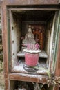 Singapore, July 24, 2022 - Roadside prayer alter with burned candles