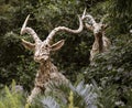 Singapore, July 24, 2022 - Statue of antelopes leaping through a forest