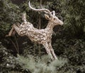 Singapore, July 24, 2022 - Statue of antelopes leaping through a forest