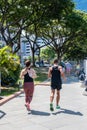 Joggers running by the Singapore River