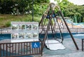 Singapore-27 JUN 2019: metal handicapped Swing infrastructure in public playground view