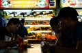 Singapore-29 JUN 2019: people eating singapore local cuisine nasi lemak in food court