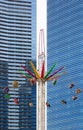 Singapore-10 MAR 2018: Singapore marina bay Carnival,People enjoying attraction ride in front of office building