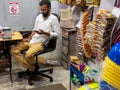 SINGAPORE - 16 MAR 2019 Ã¢â¬â A Singaporean Indian male shopkeeper in a traditional corner store / provision shop / minimart