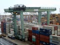 Gigantic crane to load and unload containers on trucks at the container port of Singapore