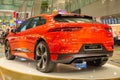 Singapore. March 2019. Orange Jaguar I-Pace all electric SUV. Back side view. Standed in Changhi airport. I Pace Car of the future