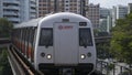 Singapore mass rapid train MRT approaching the train station