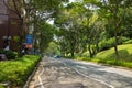 Singapore - May 1 2016: Clean and clear street with green park in Singapore