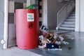Singapore May2021 Eyesore at common void deck of HDB estate in Yishun. Overflowing trash bin caused by thoughtless irresponsible Royalty Free Stock Photo