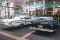 Singapore - May 25, 2019: Old vintage Chevrolet white parked on the street near other black retro car. Back side view Royalty Free Stock Photo